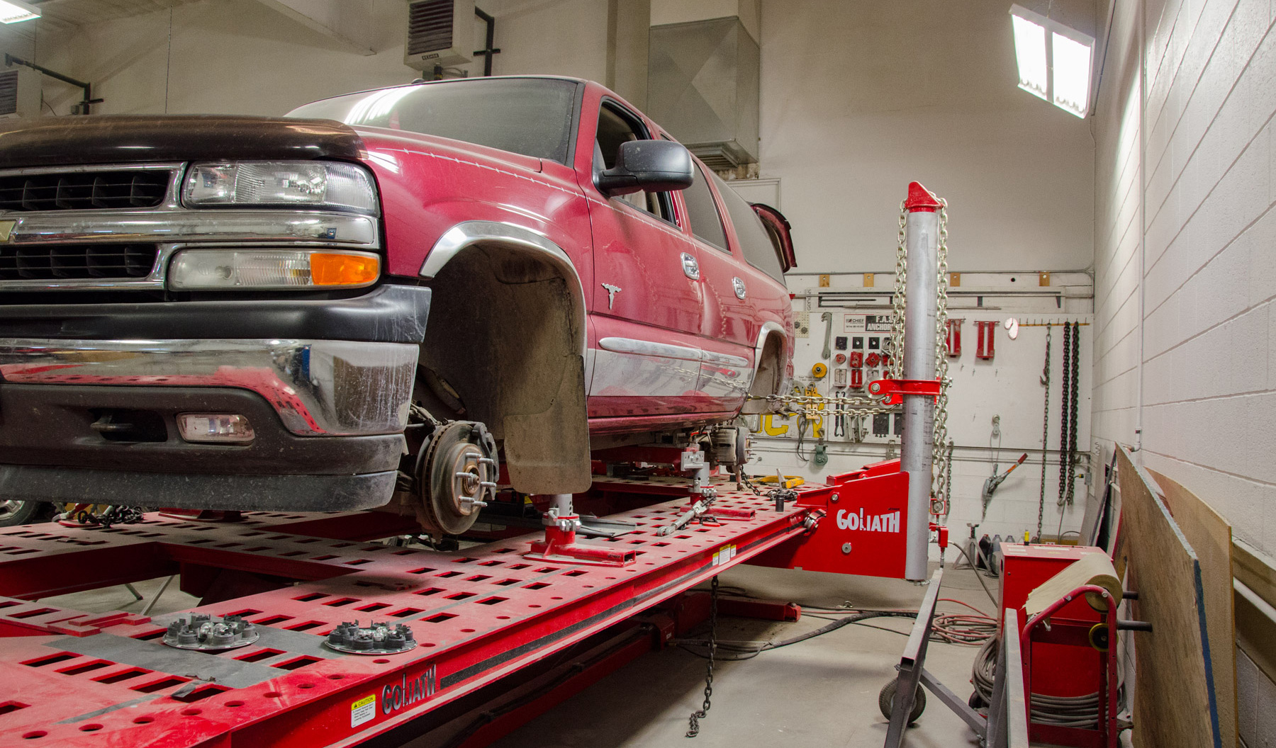 Technician performing collision repair bodywork at Taylor Body Shop in Rexburg